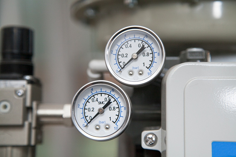 close-up of heat pump gauges.